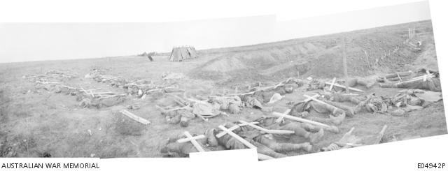 An Australian official photograph of American dead laid out near Gillemont Farm, October 1918.This is a digitally combined panorama made up of three separate images
