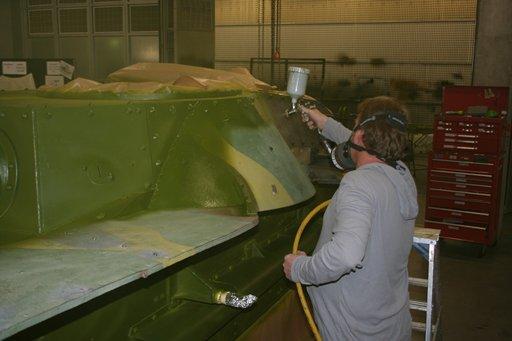 First coat of green being applied by spray painting.