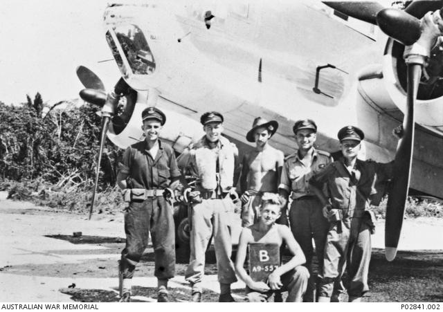  A group of 100 Squadron aircrew and ground staff beside DAP Beaufort A9-557, Tadji, New Guinea, c. 1944.