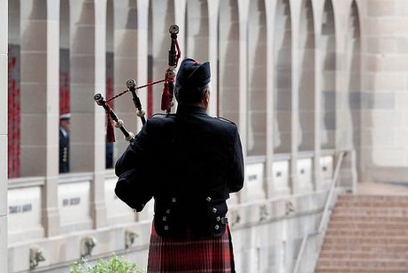 A piper at the Memorial's Last Post Ceremony