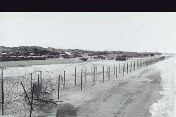 Coiled barbed wire fence on the beach, 1st Australian Logistical Support Group, Vung Tau, 1965