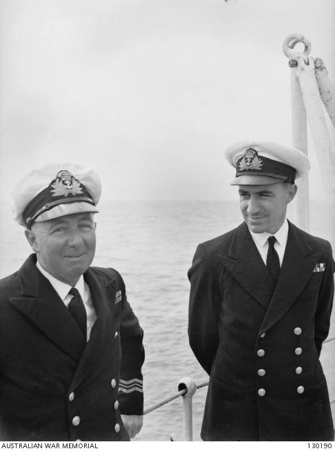 Gunnery Officer Lieutenant Commander R. I. Peek (right), who was severely burned during the kamikaze attack, with Lieutenant Commander C. R. Cliff 