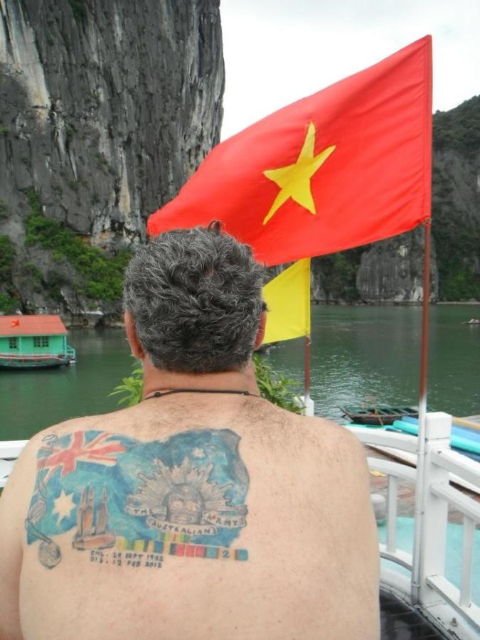 Photo of a back displaying a tattoo