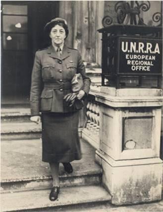 Sister Muriel Knox Doherty at the entrance to the United Nations Relief and Rehabilitation Administration's European Regional Office, 1945