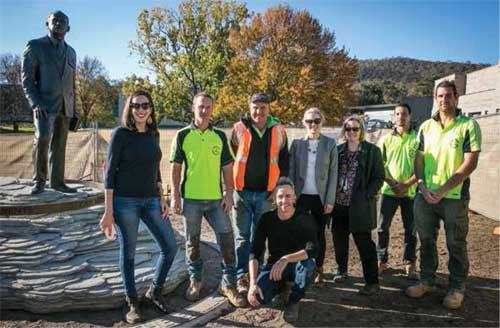 Artists, members of Gundaroo Civil and Landscaping, and Memorial staff working on the installation of the General Sir John Monash sculpture.