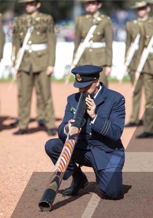 Man playing didgeridoo.