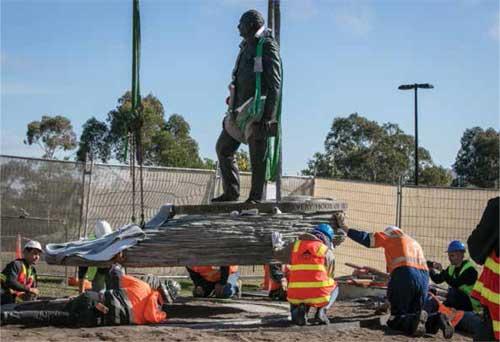 Memorial staff working on the installation of the General Sir John Monash sculpture.