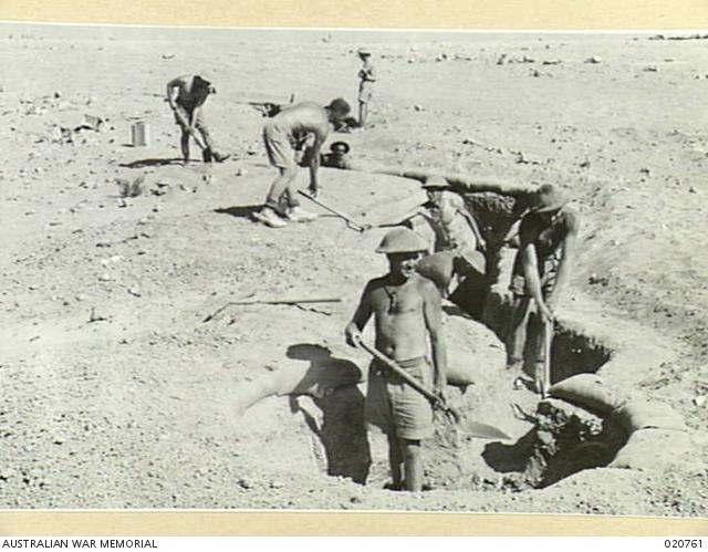 Men of the 2/13th Australian Infantry Battalion 'digging in'